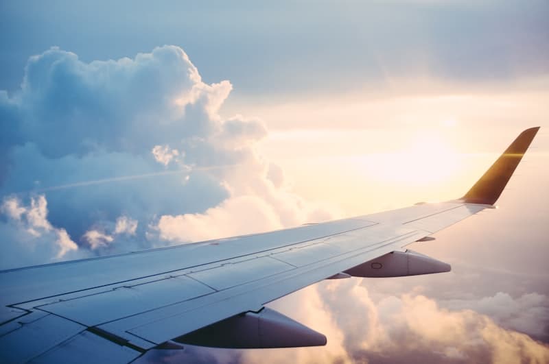 Travel experts assisting a customer with international flight booking